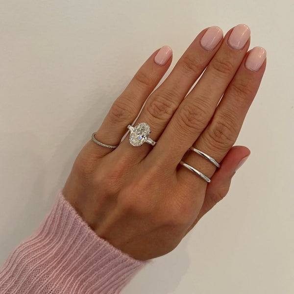 3.71ct Oval Three-Stone with with Tapered Baguette Side Stones Engagement Ring